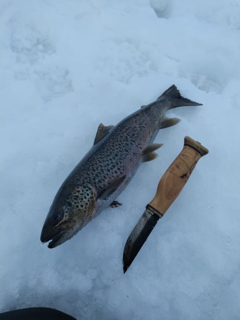 Ice fishing trip to quiet lake