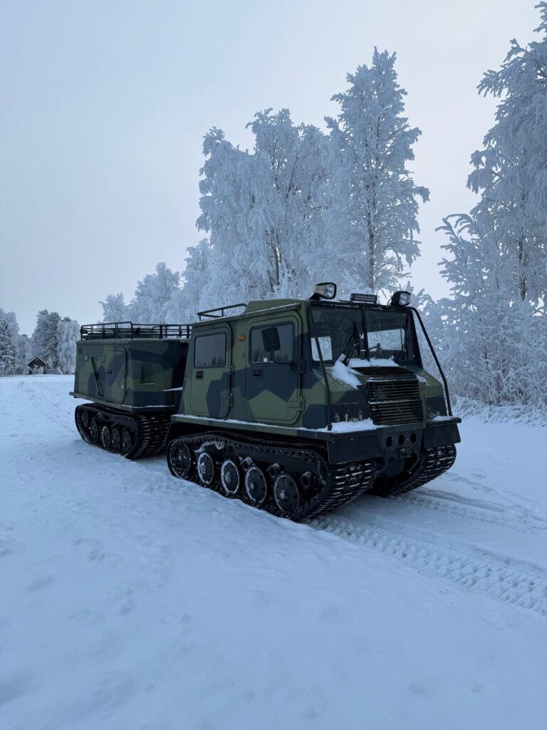 Tracked truck trip to wilderness hut