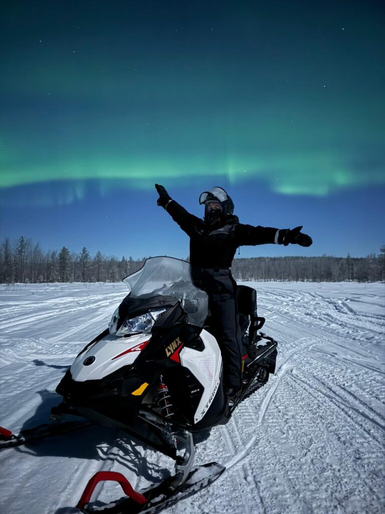 Snowmobile trip to Northern lights magical world