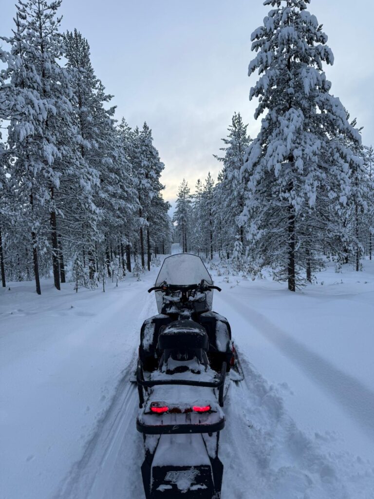 Snowmobile tour to wilderness and ice fishing trip